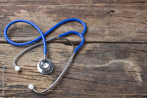 Stethoscope on wooden health .background concept.