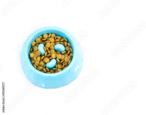 Pet bowl with dry food isolated on white. Concept product for pet