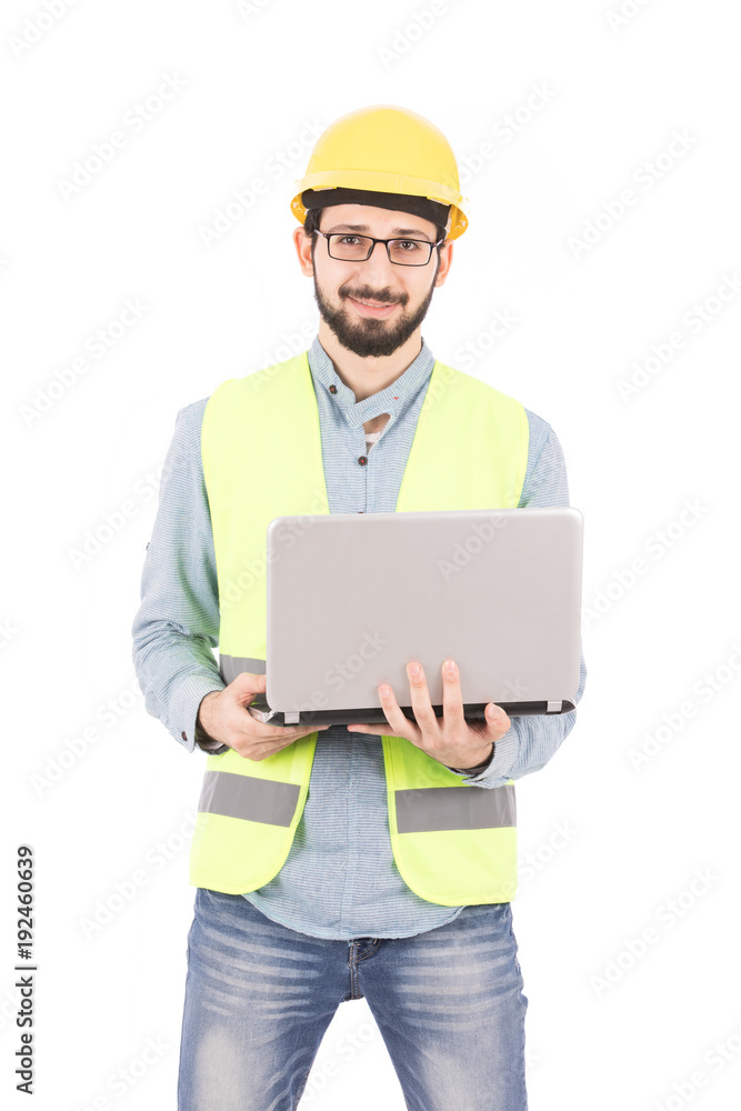 young engineer holds a laptop