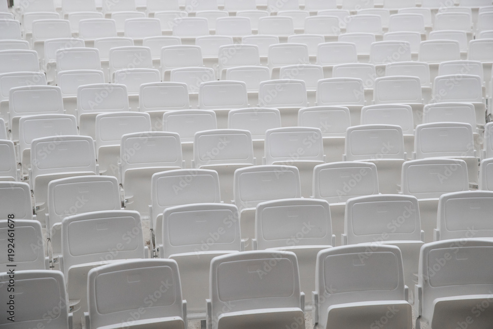 Empty white seats Empty white seats