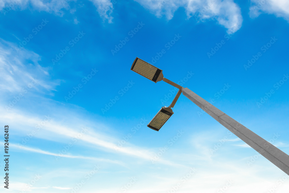 led street lamps with solar energy power on blue sky background led street lamps with solar energy power on blue sky background