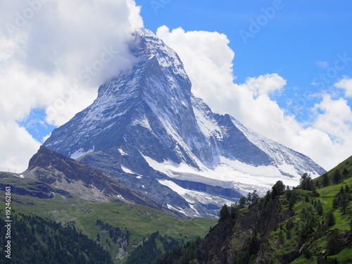 Matterhorn mount in clouds and alpine mountains range landscape in swiss Alps seen from Gornergrat in SWITZERLAND