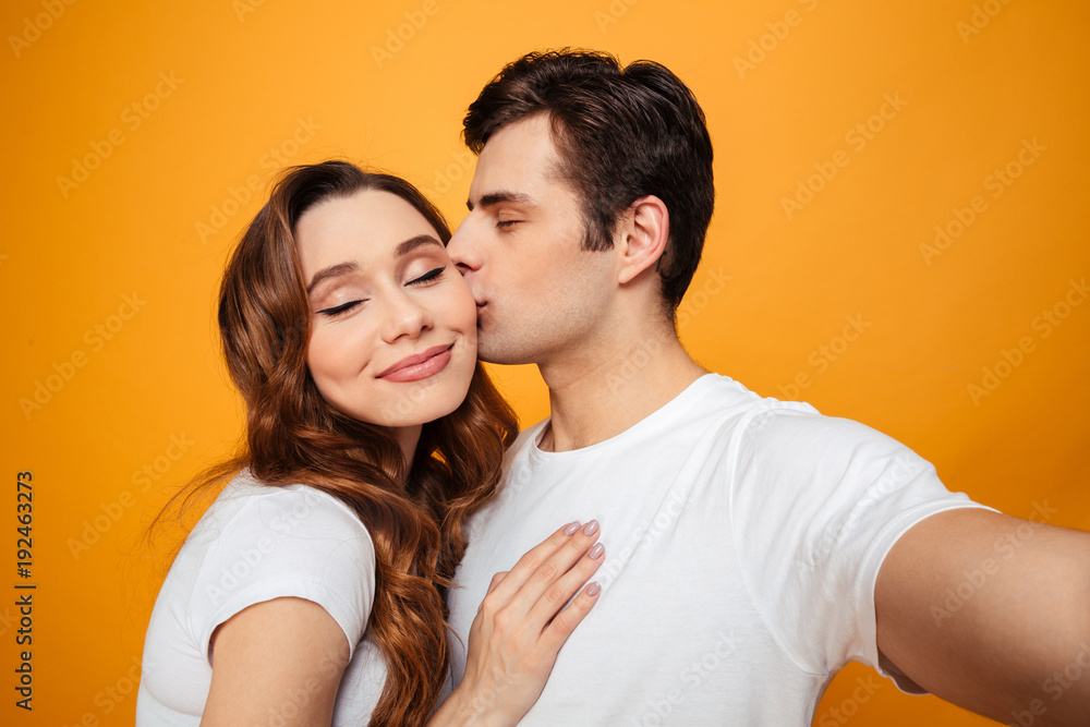 Young lovely couple posing together with klosed eyes Young lovely couple posing together with klosed eyes