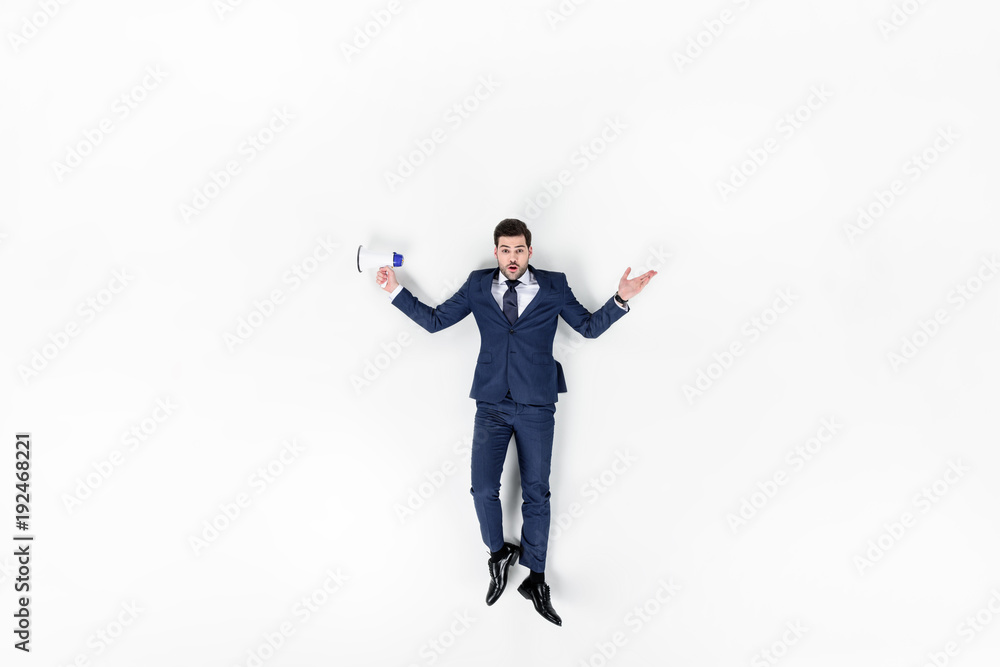 top view of young manager with loudspeaker isolated on white top view of young manager with loudspeaker isolated on white