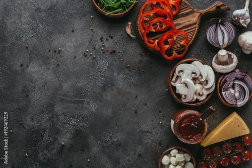 Fotografie top view of raw pizza ingredients on concrete table