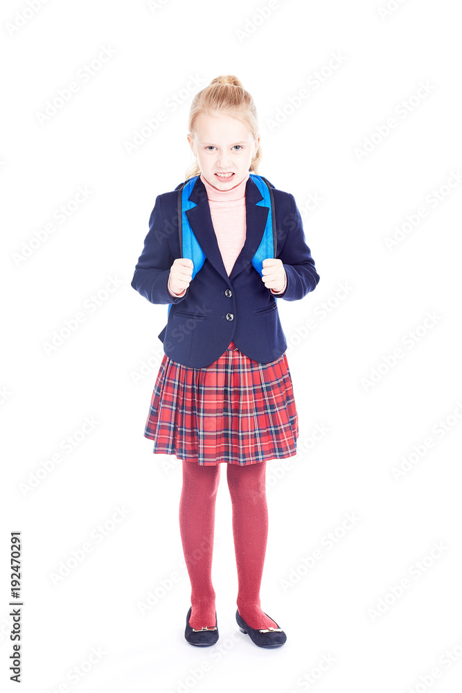 Studio portrait of beautiful blonde elementary student wearing school uniform Studio portrait of beautiful blonde elementary student wearing school uniform
