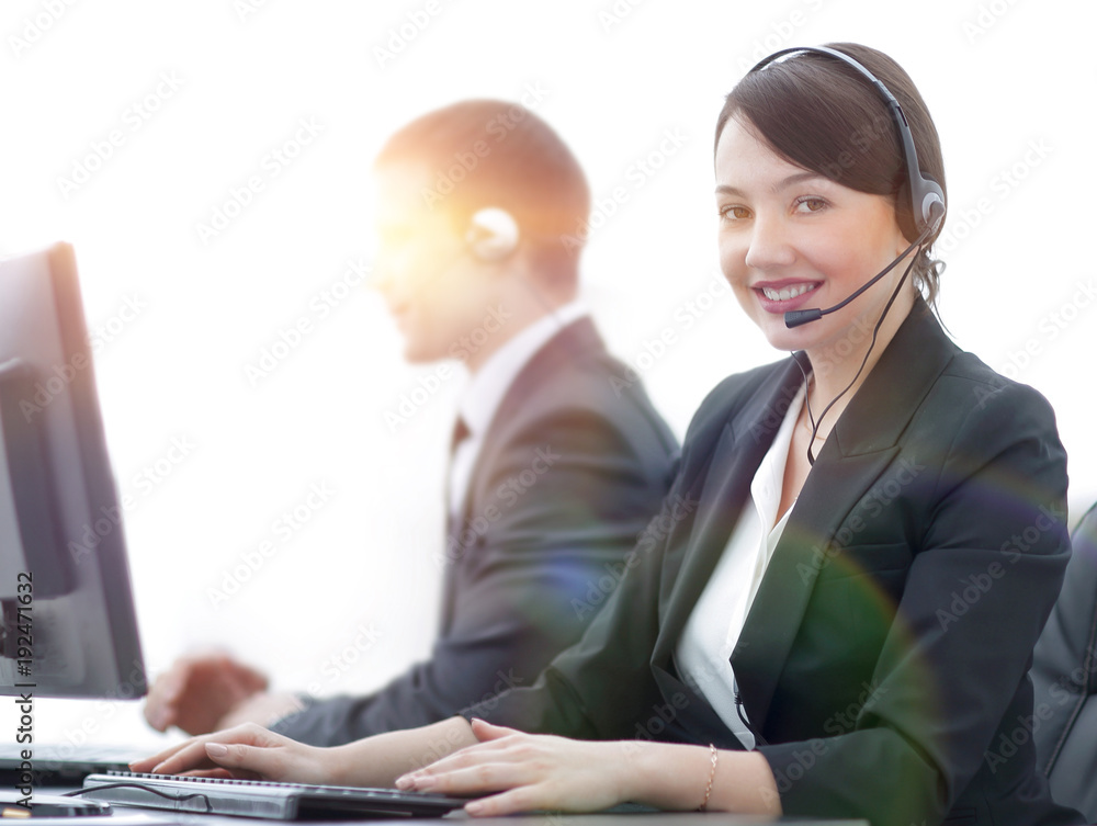 Female Customer Services Agent With Headset Working In A Call Center Female Customer Services Agent With Headset Working In A Call Center