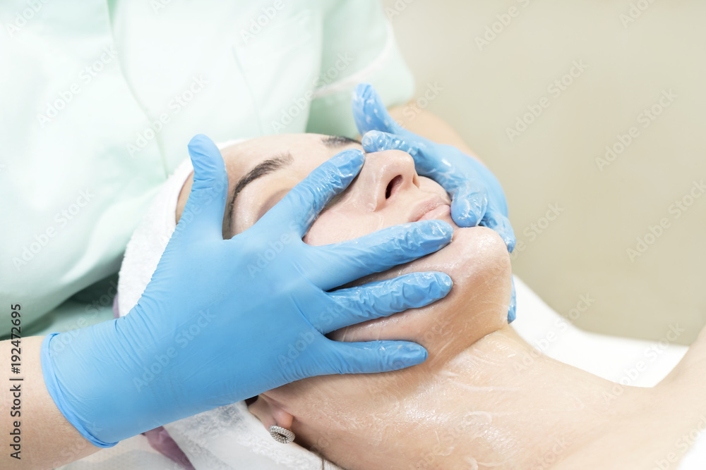 Massage and facial peels at the salon using cosmetics Massage and facial peels at the salon using cosmetics