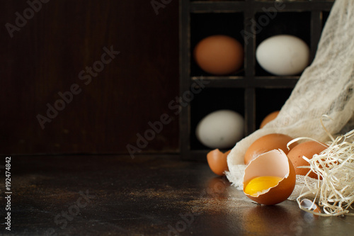 Сhicken eggs  on a dark background photo