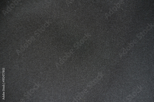 Texture of simple black fabric from above © Anna