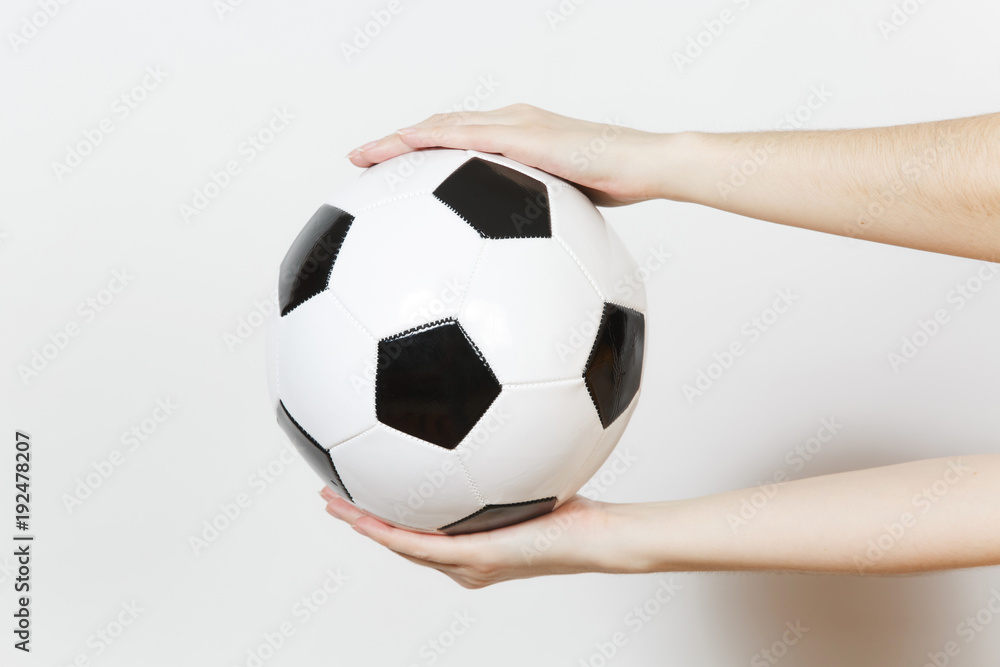 Female hands horizontal holding soccer classic white black ball isolated on white background. Sport, play football, health, healthy lifestyle concept. Female hands horizontal holding soccer classic white black ball isolated on white background. Sport, play football, health, healthy lifestyle concept.
