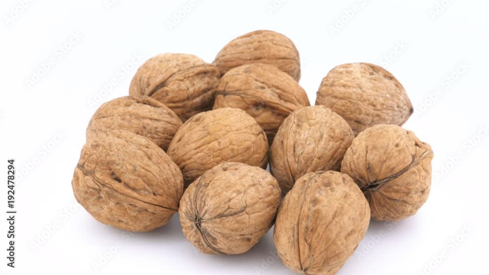 Walnuts isolated rotating on white background Walnuts isolated rotating on white background