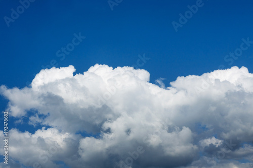 white fluffy clouds against the blue sky