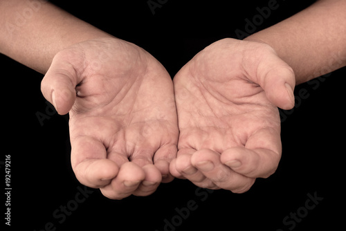 Two hands with open palms - hand gesture isolated on black background with copyspace