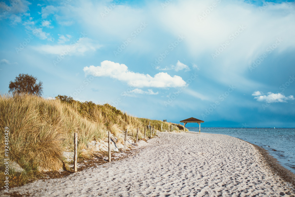 small hut on the beach in summer with blue sky