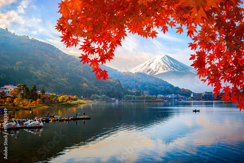 Mount fuji at Lake kawaguchiko with sunrise in the morning and Autumn colorful red maple leaf.
