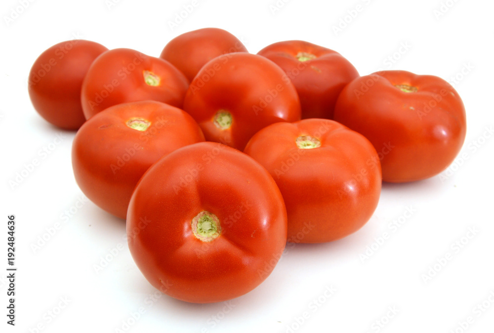 Closeup of tomatoes on the vine isolated on white Closeup of tomatoes on the vine isolated on white