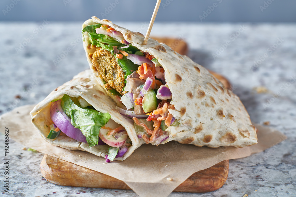 vegan food- tasty falafel wrap in gluten free bread - obrazy, fototapety, plakaty 