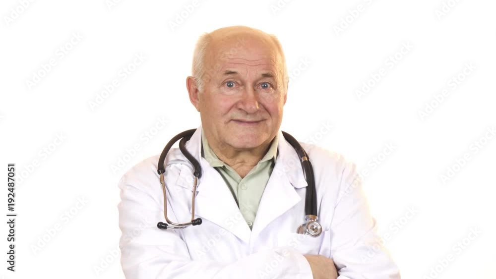 Senior male doctor with a stethoscope smiling to the camera Senior male doctor with a stethoscope smiling to the camera