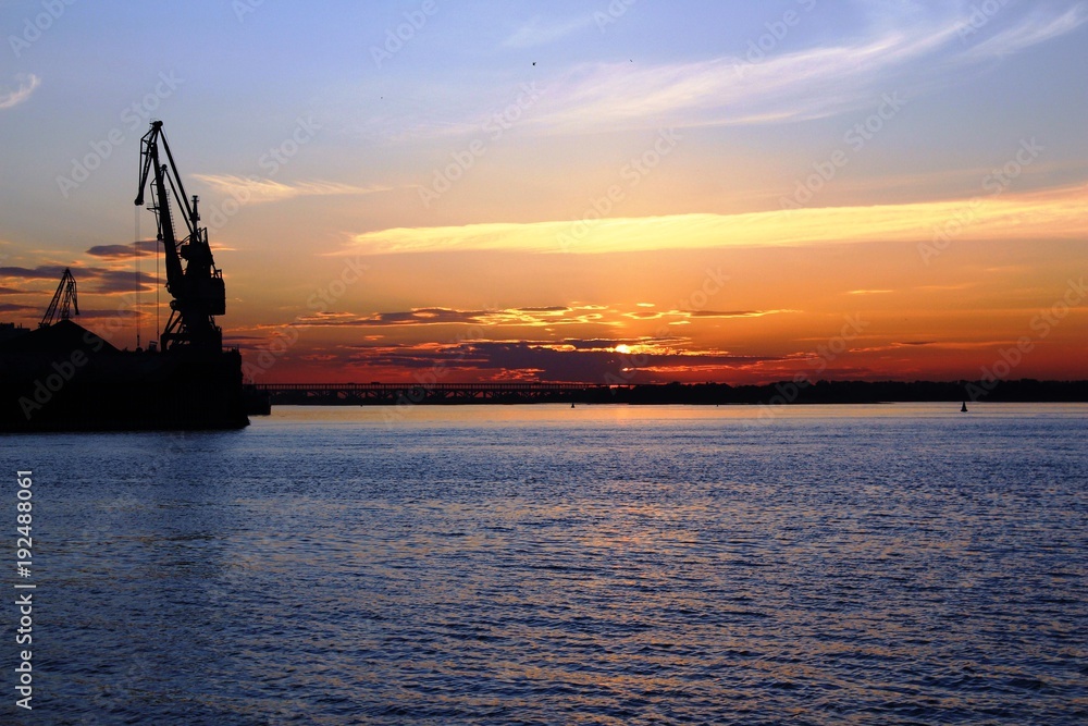 Nizhny Novgorod, Russia, 2015: Port crane on the Volga at sunset
