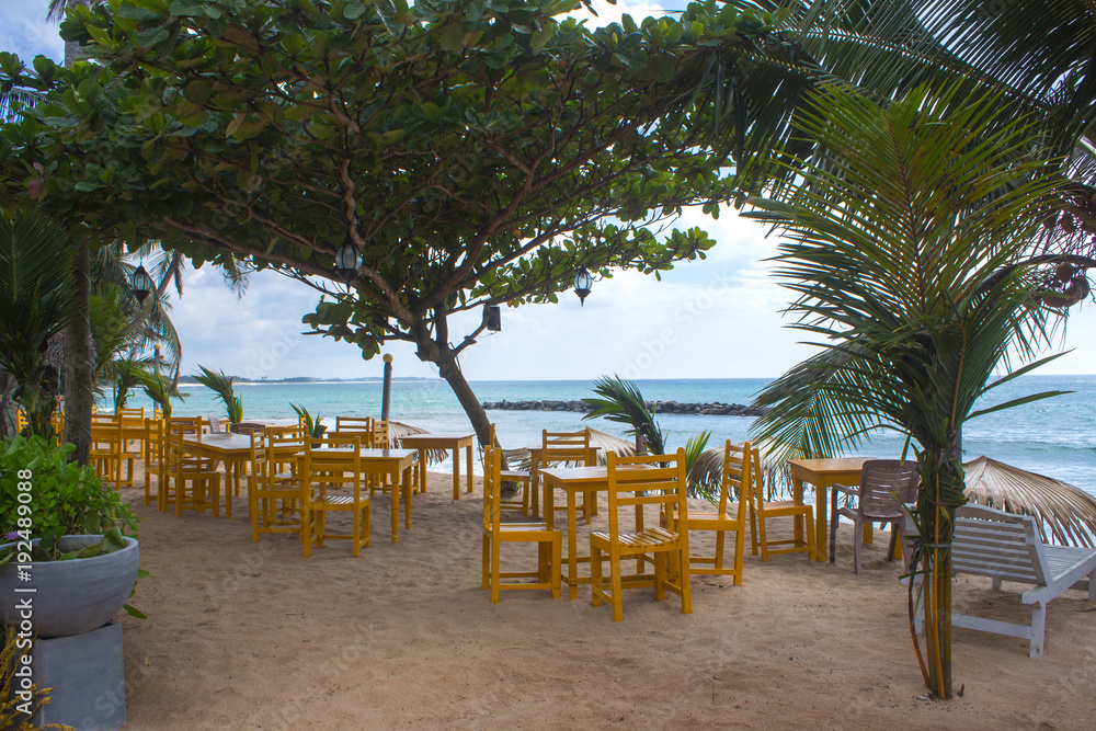 Chairs on a deserted beach. Holiday and vacation concept. Tropical beach.