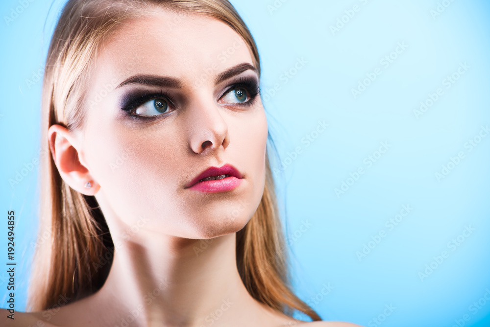 Portrait of beautiful female model on blue background Portrait of beautiful female model on blue background