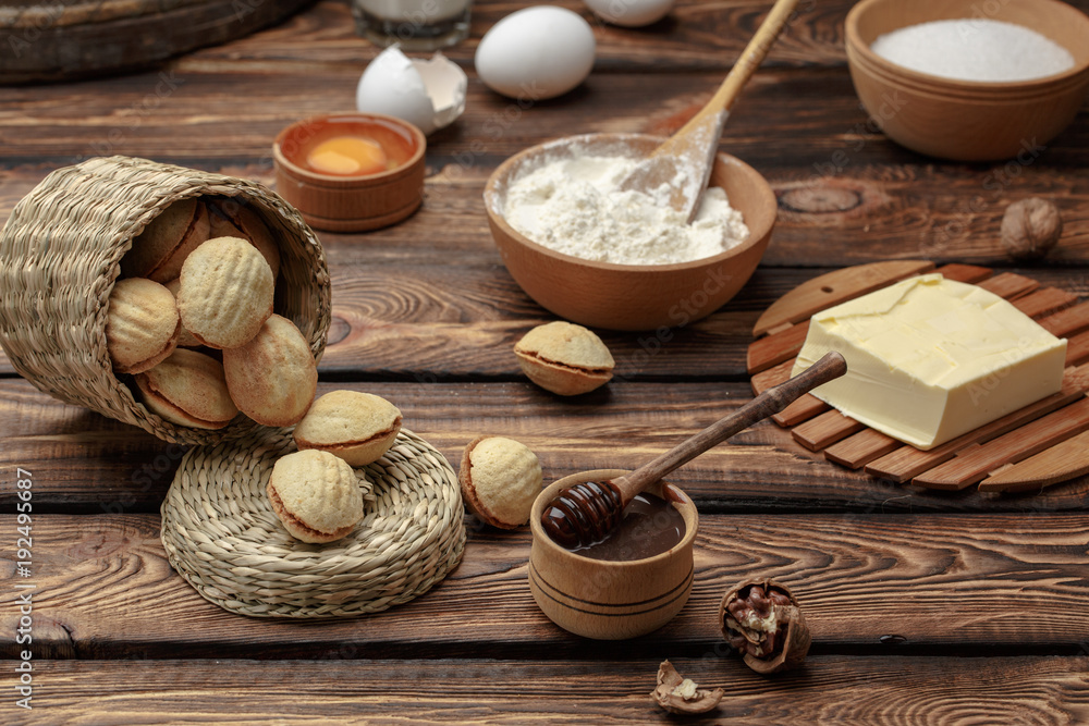 homemade cookies shaped nuts with cream boiled condensed milk on wooden table homemade cookies shaped nuts with cream boiled condensed milk on wooden table