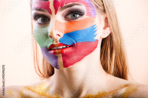 Fototapeta Naklejka Na Ścianę i Meble -  Close-up of a young girl face with creative visage face art