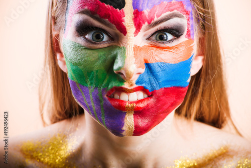 Fototapeta Naklejka Na Ścianę i Meble -  Close-up of a young girl face with creative visage face art