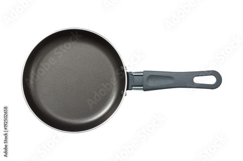 Pan. The black. Kitchen accessories. Tools for cooking. A spoon. Isolated on white background. For your design. An object.