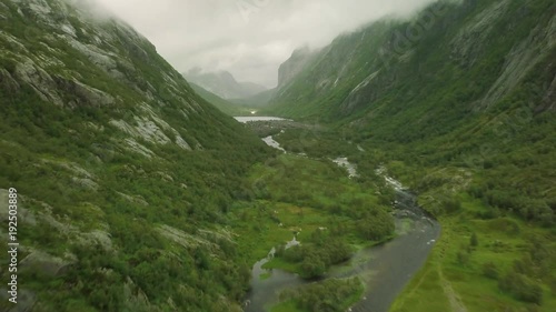 Breathtaking aerial view on the huge waterfall and the valley around it. 4k footage, bird view. Norway, Manafossen.