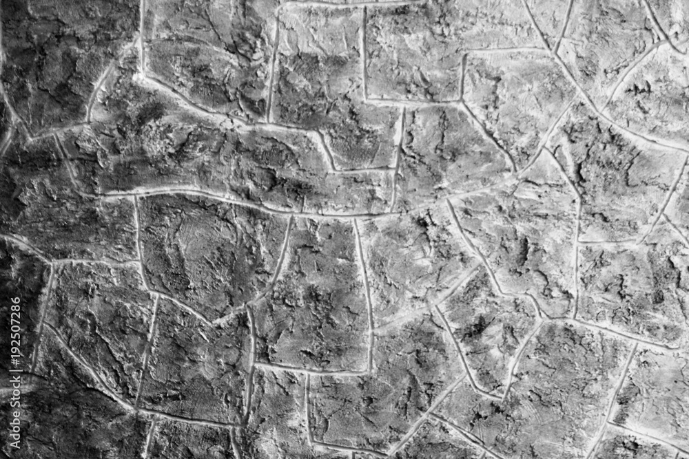 Obraz premium Fragment of a wall from a chipped stone