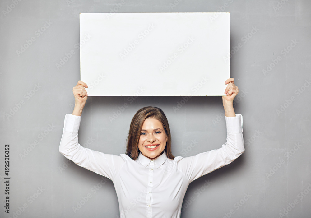 Happy business woman holding big white sign board. Happy business woman holding big white sign board.