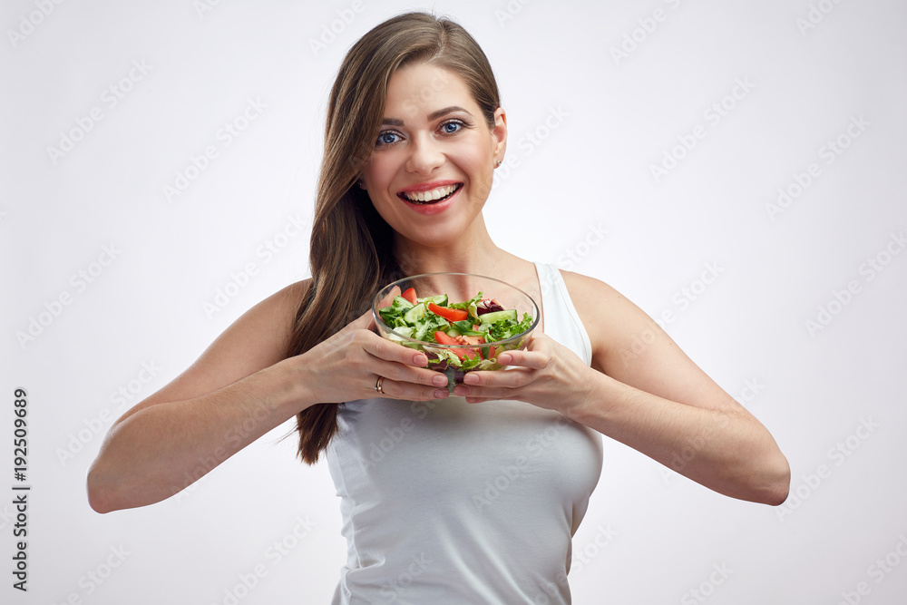 Young positive woman holding salad bowl. Young positive woman holding salad bowl.