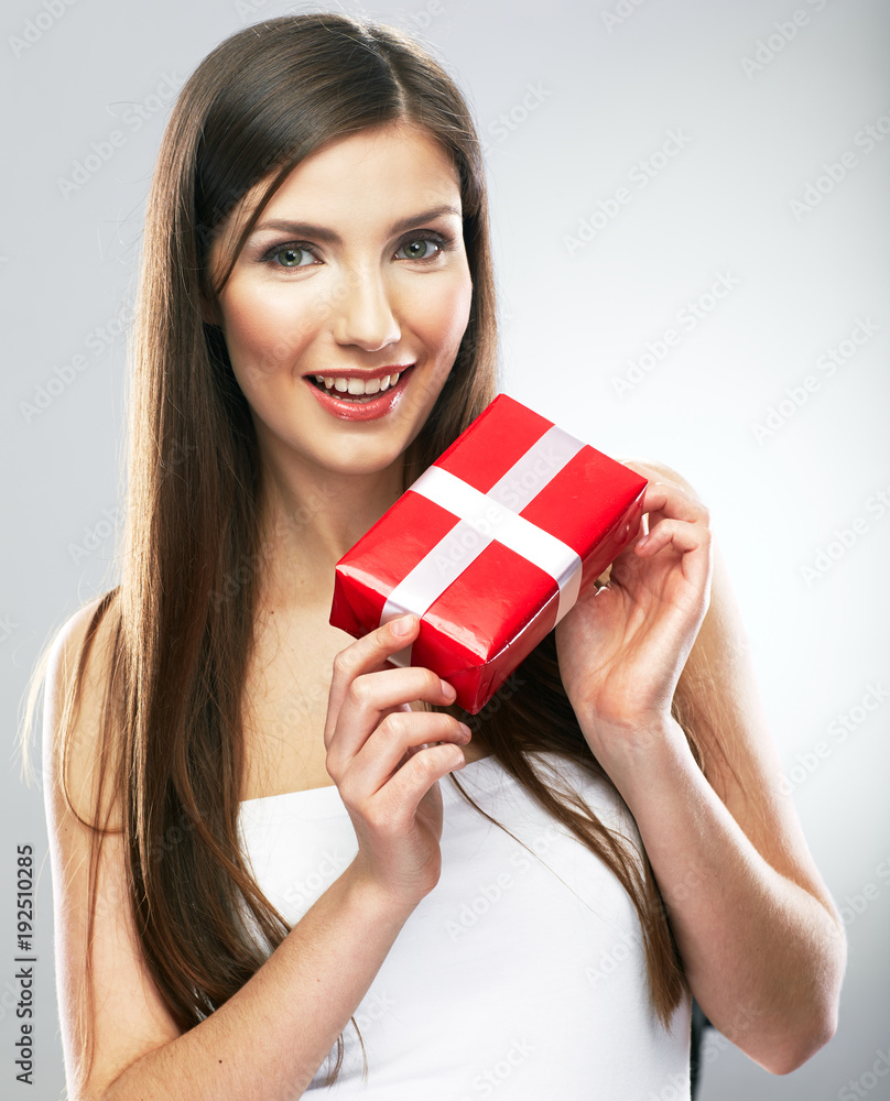 Smiling girl holding red gift box. Smiling girl holding red gift box.