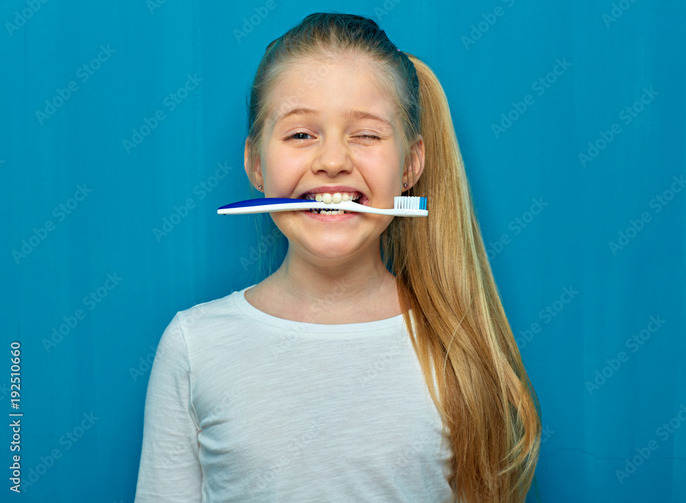 Funny portrait og little girl holding toothy brush. Funny portrait og little girl holding toothy brush.