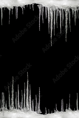 Icicles on a black background, space for text, template for design © dero2084