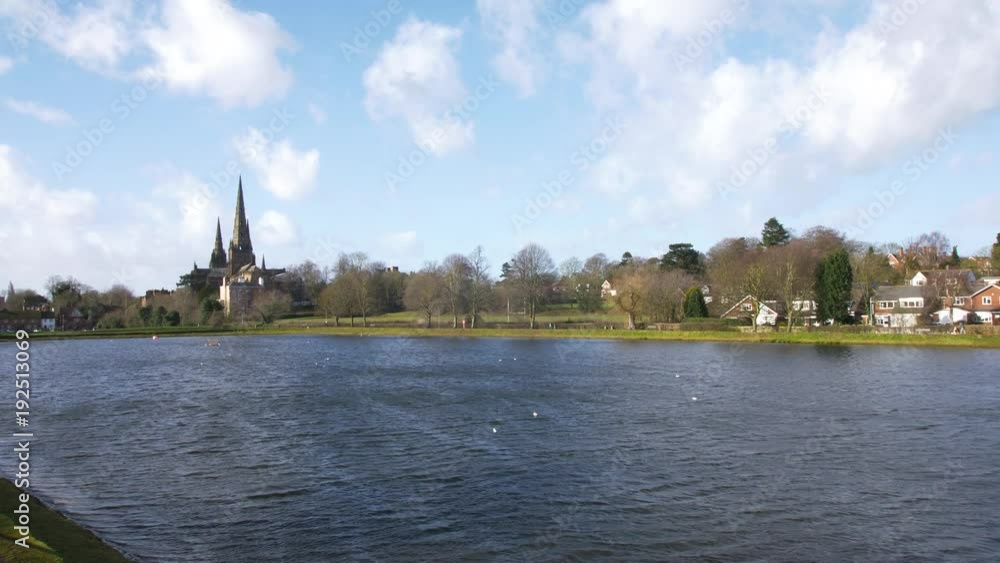 A Static Shot of a Crystal Clear Blue Lake With Cathedral Spires on the Horizon A Static Shot of a Crystal Clear Blue Lake With Cathedral Spires on the Horizon