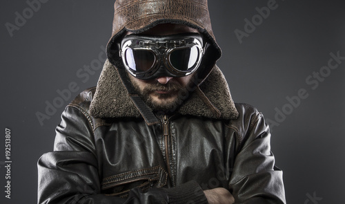 Army, recreation of the Second World War, old airplane pilot with brown leather jacket, cap of avidor and large glasses