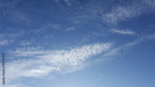 Cirrus cloud in the blue sky. High in the sky feathery clouds