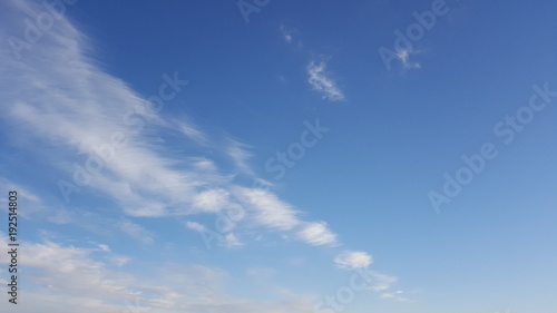Cirrus cloud in the blue sky. High in the sky feathery clouds photo