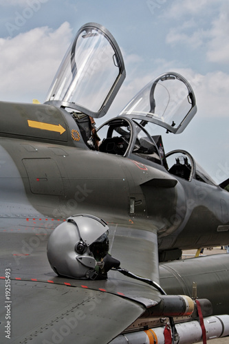 Pilot helmet on the wing of a fighter jet