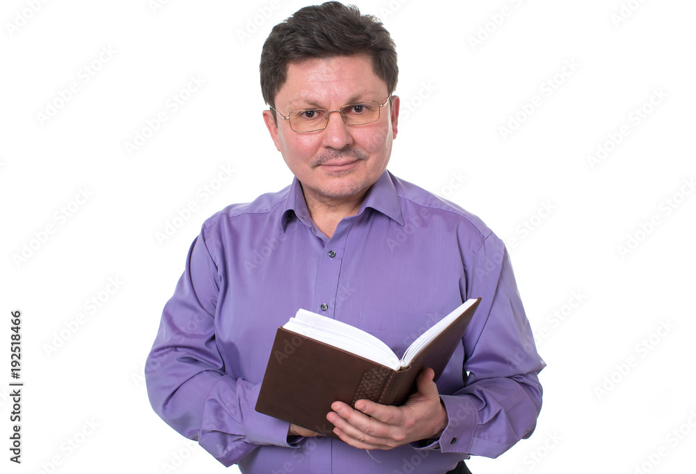 Middle aged man wearing glasses with a book in his hands. Middle aged man wearing glasses with a book in his hands.