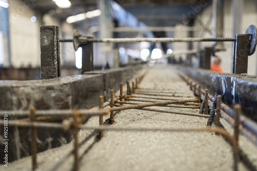 Liquid cement entering mold to build a concrete structure. Ferralla inside to give structure consistency photo