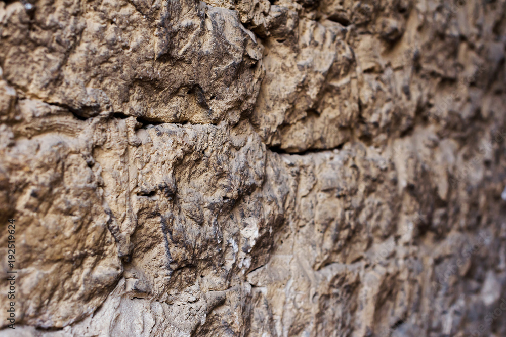 Close up Textured background of a wall of medieval stone masonry. The wall is sloppy built of mountain stones. Medieval style Close up Textured background of a wall of medieval stone masonry. The wall is sloppy built of mountain stones. Medieval style