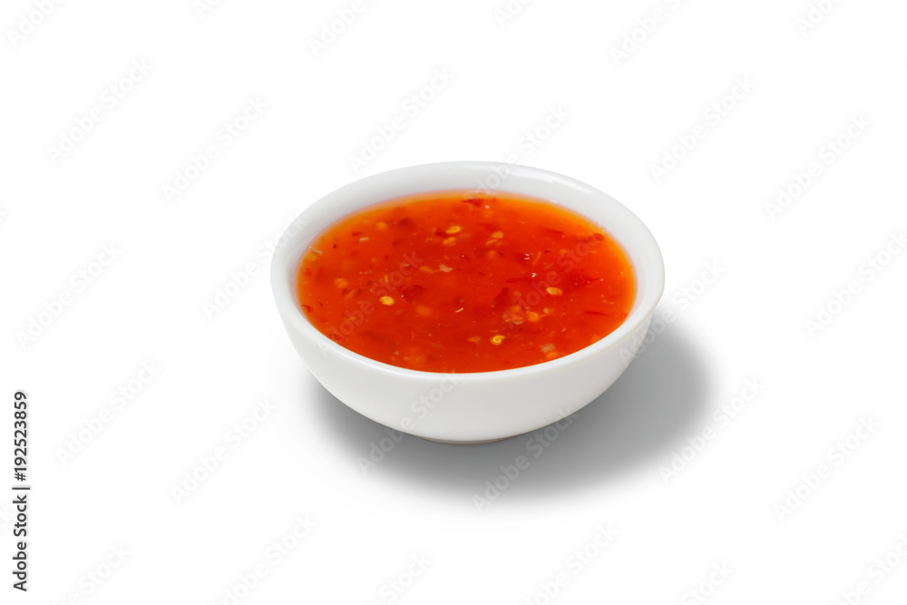 Chilli sauce in a gravy boat on white background Chilli sauce in a gravy boat on white background
