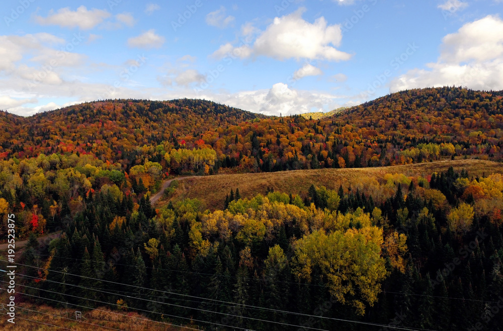 Aerial of colorful mountains during fall in Quebec