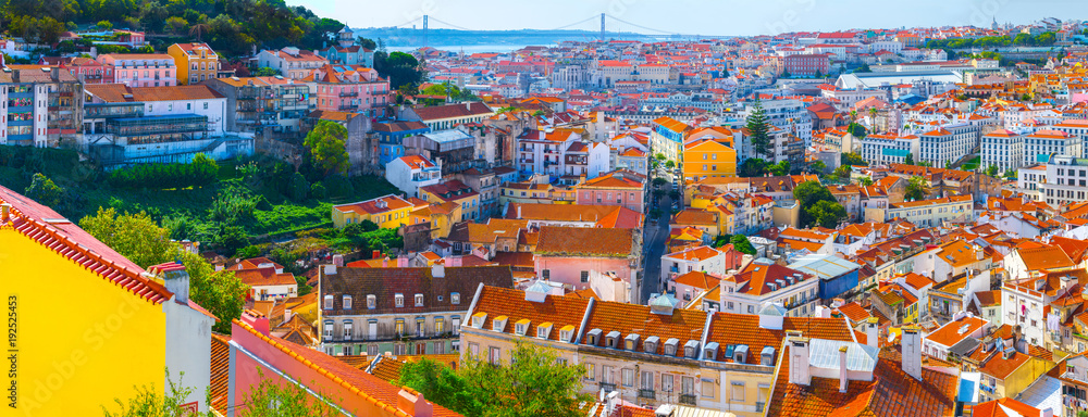 Summertime sunshine day cityscape panoramic view of town and all historic old centre in Lisbon, Portugal.