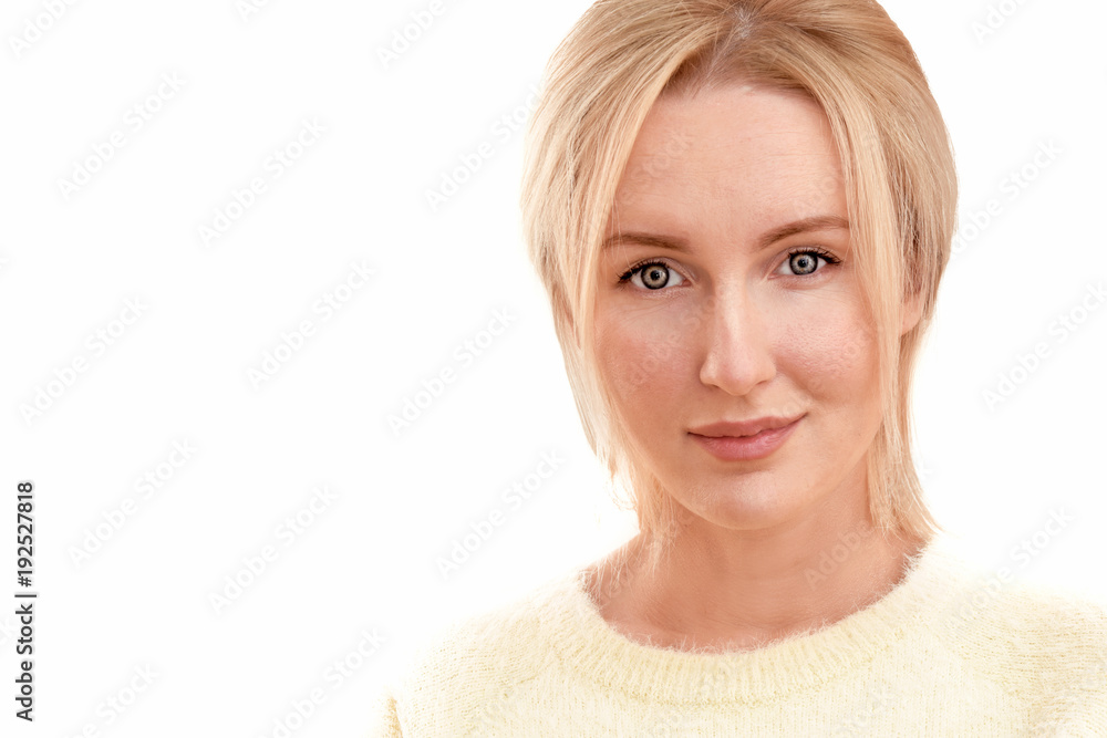 Beautiful blonde woman with a kind smile and eyes, clean natural skin in a yellow sweater isolated on a white background Beautiful blonde woman with a kind smile and eyes, clean natural skin in a yellow sweater isolated on a white background