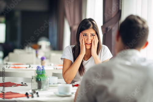 Shocked woman in disbelief handling bad news.Stressed crying female hearing about financial problems.Bankruptcy.Loosing property.Relationship problems.Not believing.Reaction to the negative event photo